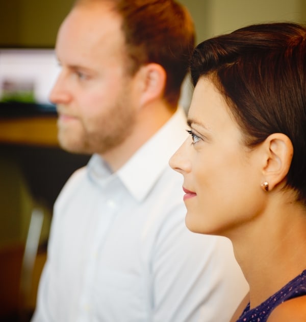 Team members listening in a meeting