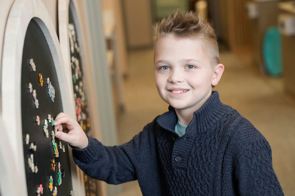Young boy playing in dental office waiting room