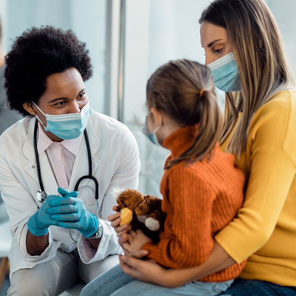 doctor consulting with mother and child