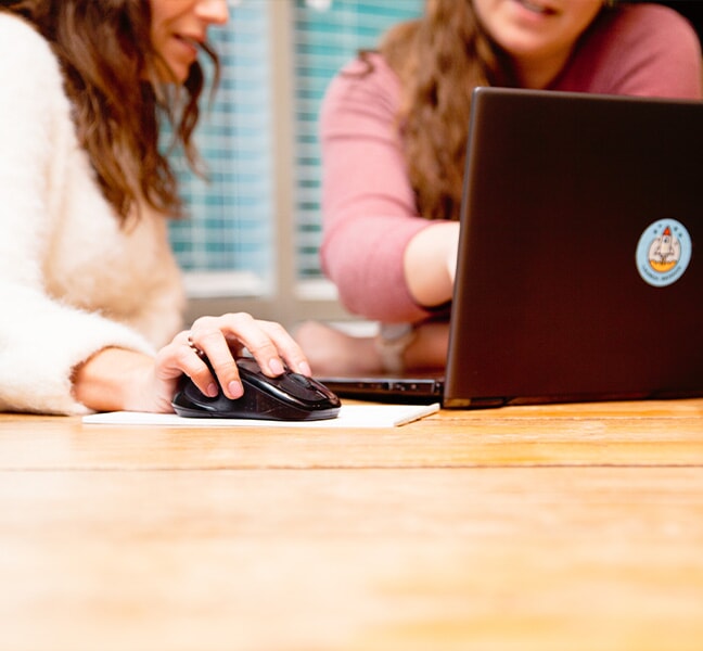 Team reviews information on computer together