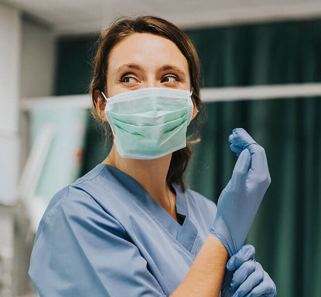 Nurse in surgical mask and gloves