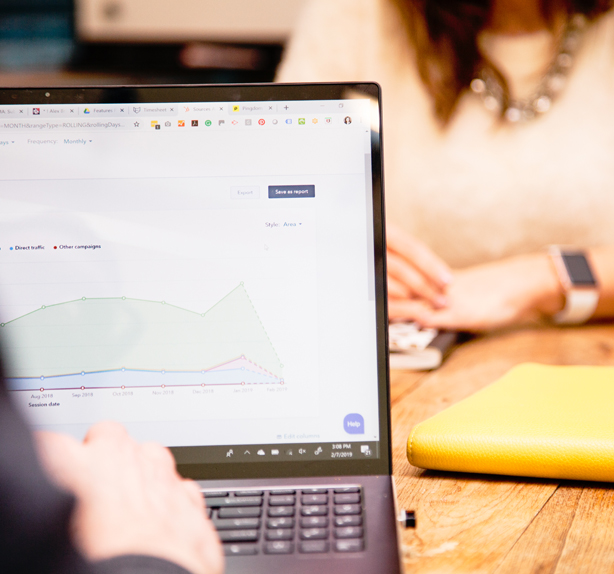 marketer viewing site analytics on laptop