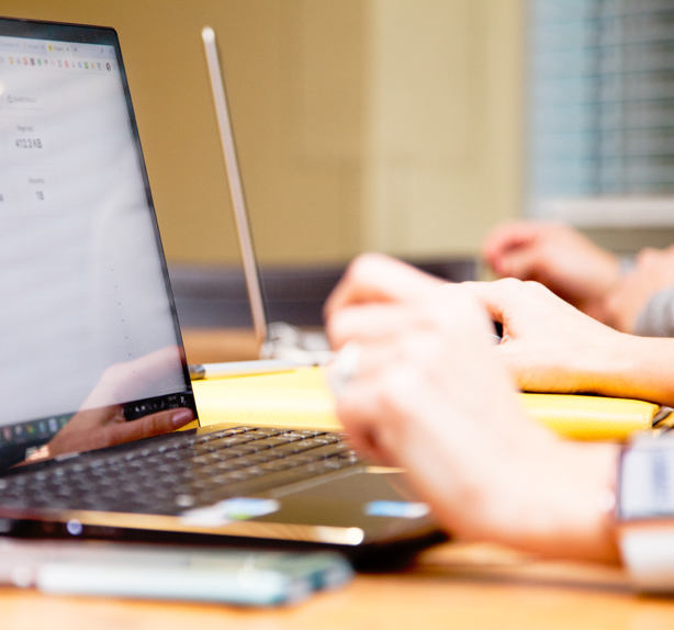 close-up of person using a laptop
